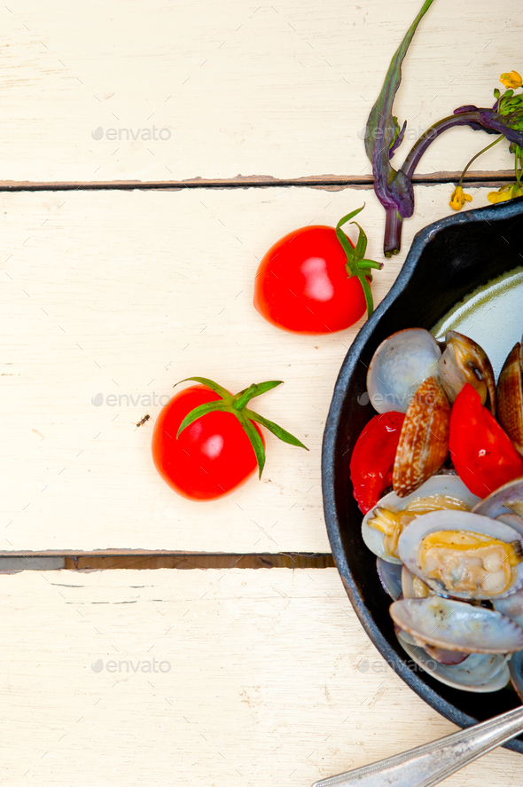 fresh clams on an iron skillet Stock Photo by keko64 PhotoDune